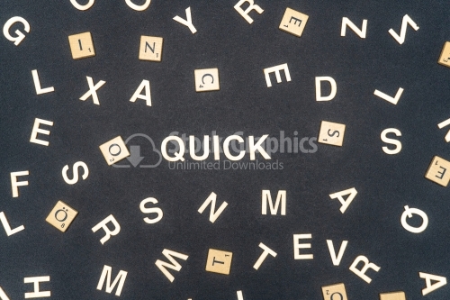 QUICK word written on dark paper background. QUICK text for your concepts