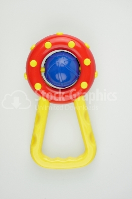 Rattle red and yellow - Stock Image