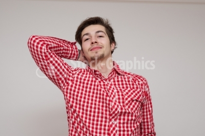 Relaxed young guy on a white background