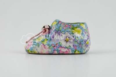 Slipper with flowers decoration porcelain isolated on white