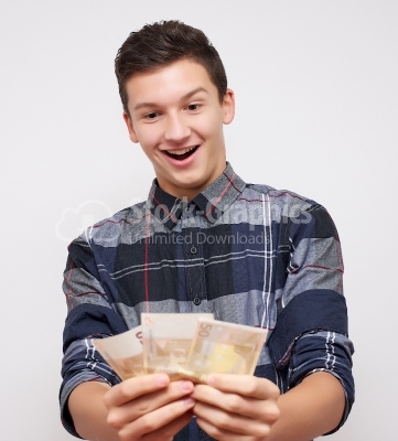 Smart young businessman holding Euro banknotes - Stock Image