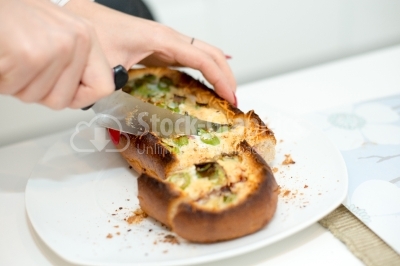 Snack with onion and parmesan, cut with knife