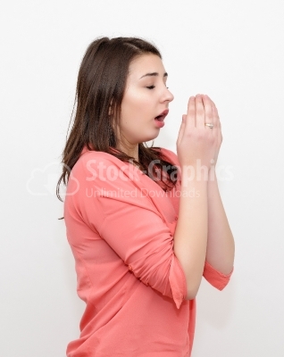 Sneezing young attractive woman stock photo