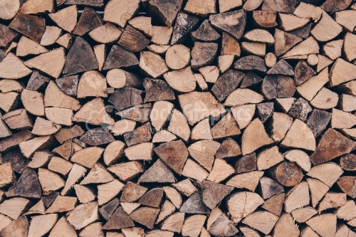 Stack of chopped firewood of birch. Wooden texture or abstract b