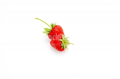 Strawberries with green leaves on white background