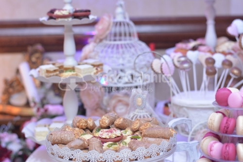 Sweet rolls with vanilla cream in a pink decor. Candy bar