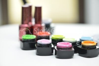 Training solutions and ultra violet gel nails on the table