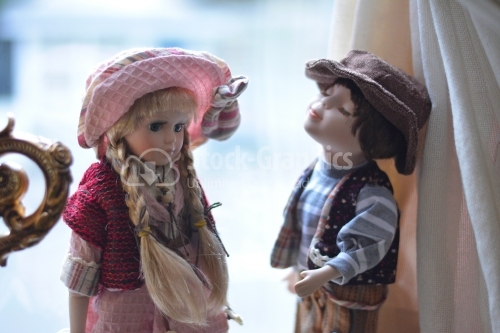 Two porcelain dolls. Girl and boy who love each other.