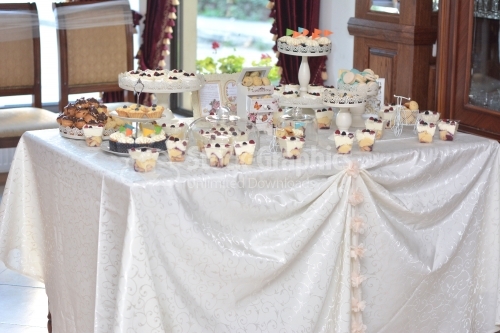 Variety cake on the festive table. Wonderful dishes with berries. Beautiful and delicious candy bar for guests