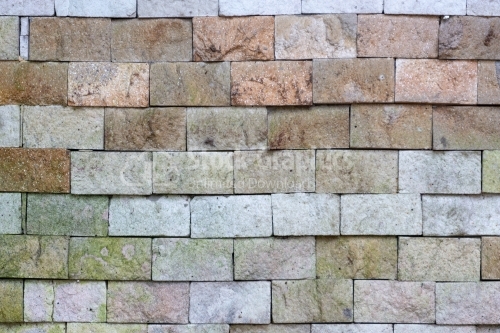 Weathered texture of stained old dark brown and red brick wall b