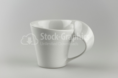 White porcelain mug on white background