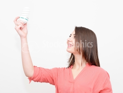Woman holding an energy saving lightbulb