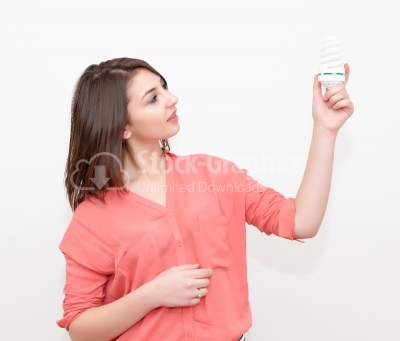 Woman holding an energy saving lightbulb