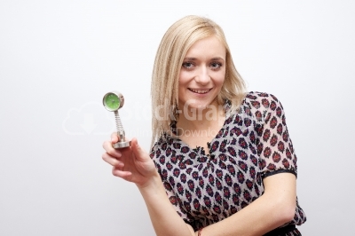 Woman holding clock - Stock Image