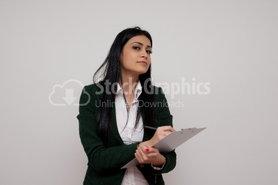 Woman making notes on a clipboard
