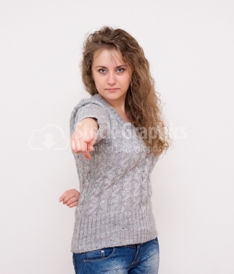 Woman pointing finger towards you and to the camera