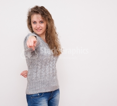 Woman pointing finger towards you and to the camera