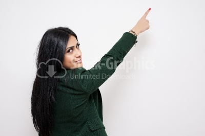 Woman pointing her finger towards blank space