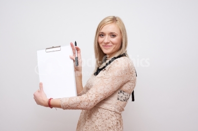 Woman using a clipboard - Stock Image