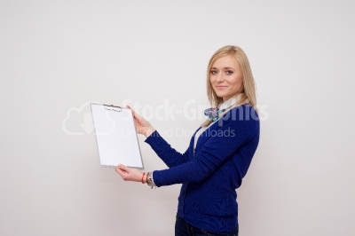 Woman with a white clip board looking at you