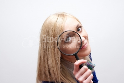 Woman with magnifying glass