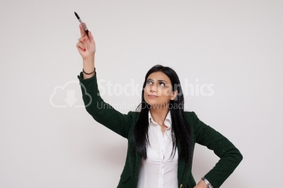 Woman writing or drawing something on screen or transparent glas