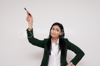 Woman writing or drawing something on screen or transparent glas