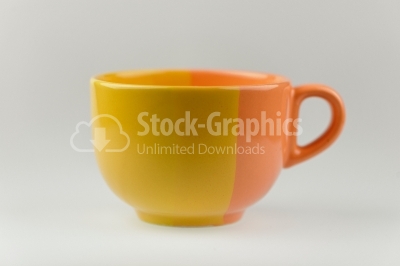 Yellow and orange soup bowl on white background