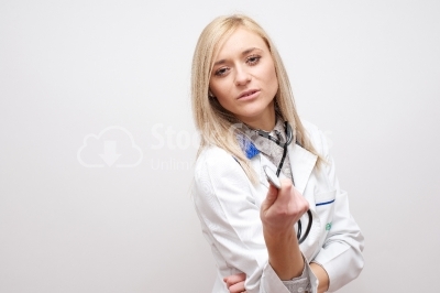 Young beautiful successful female doctor with stethoscope 