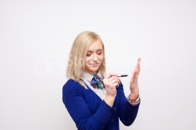 young blonde girl drawing on hand