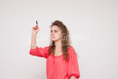 Young business woman writing or drawing something on screen or t