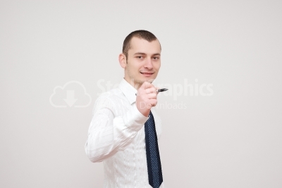 Young businessman holding a pen