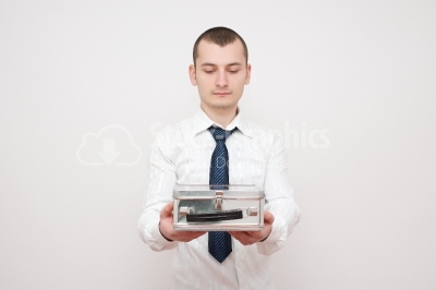 Young businessman looking at a box