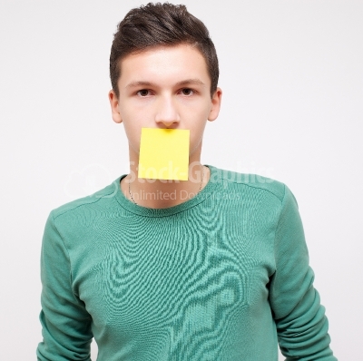 Young businessman with empty adhesive note