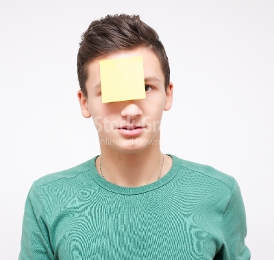 Young businessman with empty adhesive note