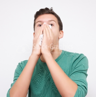 Young man blowing her nose with  background