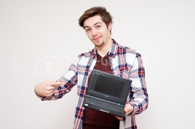 Young man presenting his notebook computer
