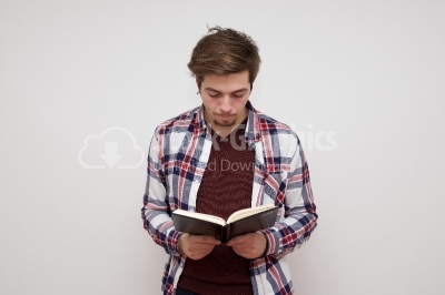 Young man readng from his book