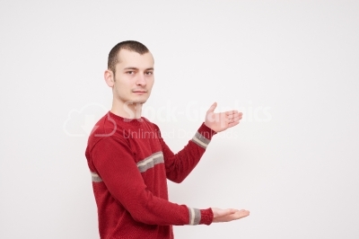 Young man showing something stock photo