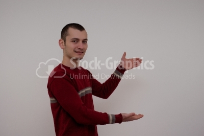 Young man showing something stock photo