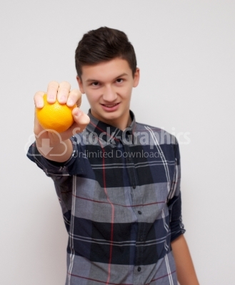 Young man with orange on white