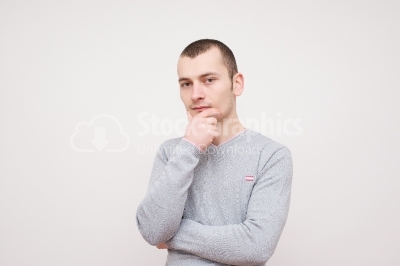 Young thoughtful man isolated over white background