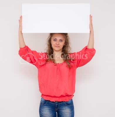 Young woman holding a white panel above her head isolated on whi