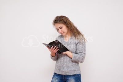 Young woman holding her datebook 
