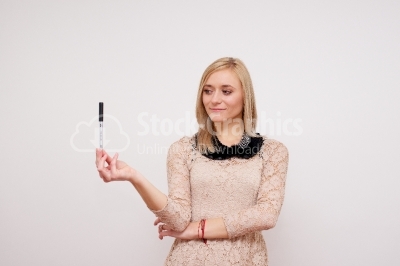 Young woman holding pen