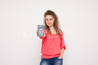 Young woman with a calculator in her hands