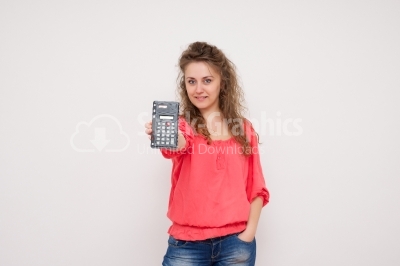 Young woman with a calculator in her hands