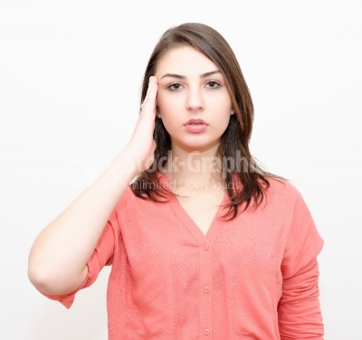 Young woman with headache, holding her hand to the head